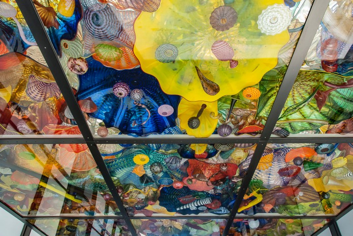 Dale Chihuly outdoor glass ceiling over a walk.